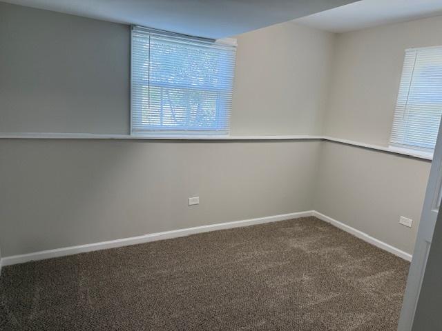 3018 20th St, North Chicago, IL 60064 - unfurnished room featuring carpet flooring and baseboards