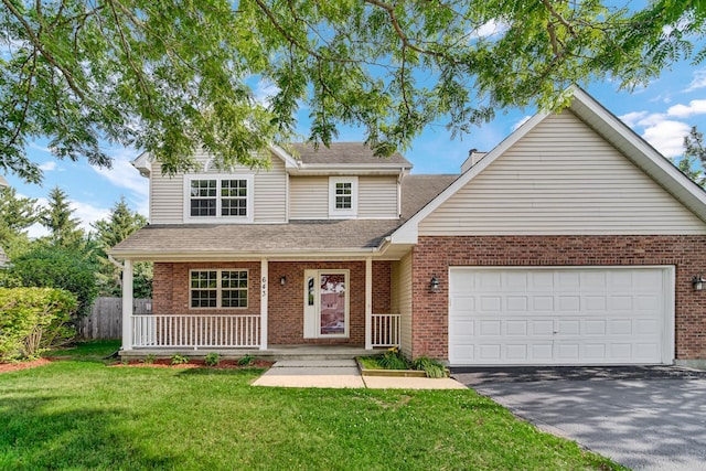 643 N Bridgeport Ter, Lindenhurst, IL 60046 - traditional home with brick siding, asphalt driveway, and an attached garage