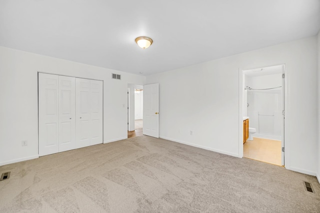 643 N Bridgeport Ter, Lindenhurst, IL 60046 - unfurnished bedroom with carpet flooring, a closet, and connected bathroom