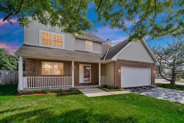 643 N Bridgeport Ter, Lindenhurst, IL 60046 - traditional-style home with brick siding, covered porch, an attached garage, driveway, and roof with shingles