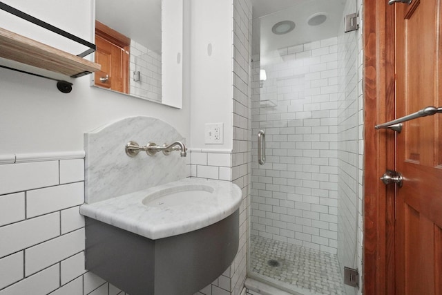 2753 N Spaulding Ave Unit Gs, Chicago, IL 60647 - full bathroom featuring tile walls, a shower stall, a wainscoted wall, and vanity