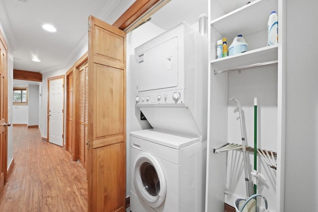 2753 N Spaulding Ave Unit Gs, Chicago, IL 60647 - laundry room featuring stacked washer / dryer, light wood-style flooring, ornamental molding, and recessed lighting