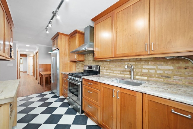2753 N Spaulding Ave Unit Gs, Chicago, IL 60647 - kitchen featuring stainless steel appliances, wall chimney exhaust hood, dark flooring, decorative backsplash, and light stone counters
