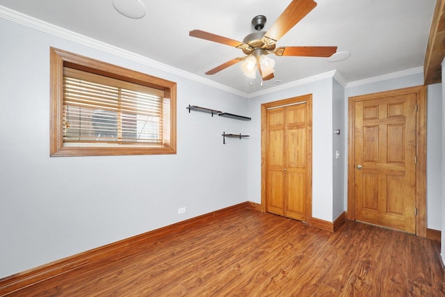 2753 N Spaulding Ave Unit Gs, Chicago, IL 60647 - unfurnished bedroom with wood finished floors, a closet, ornamental molding, and ceiling fan