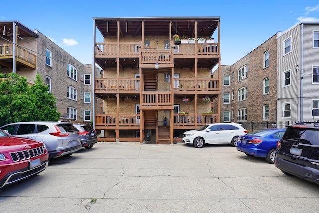 2753 N Spaulding Ave Unit Gs, Chicago, IL 60647 - view of apartment building / complex featuring uncovered parking and stairs