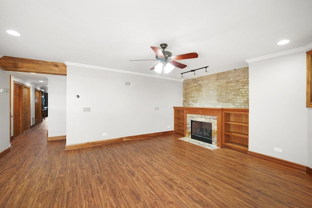 2753 N Spaulding Ave Unit Gs, Chicago, IL 60647 - unfurnished living room with ceiling fan, track lighting, a fireplace, wood finished floors, and recessed lighting