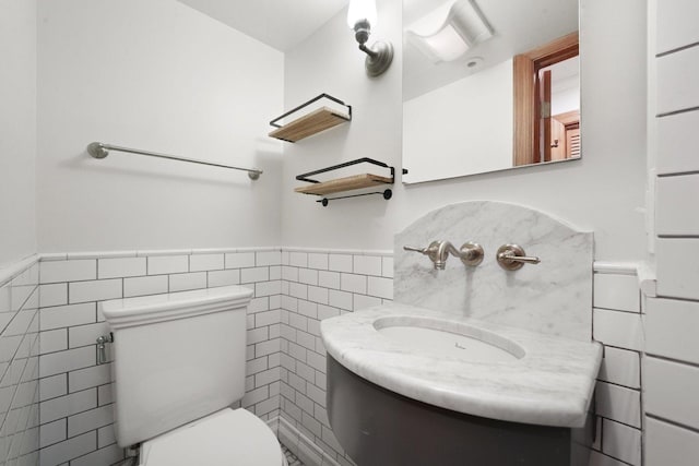 2753 N Spaulding Ave Unit Gs, Chicago, IL 60647 - half bathroom with tile walls, a wainscoted wall, and vanity