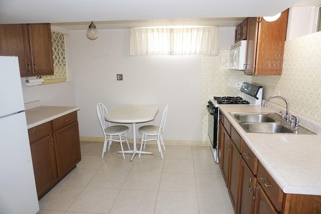 7632 W Norridge St, Harwood Heights, IL 60706 - kitchen featuring white appliances, light countertops, decorative backsplash, and light tile patterned floors