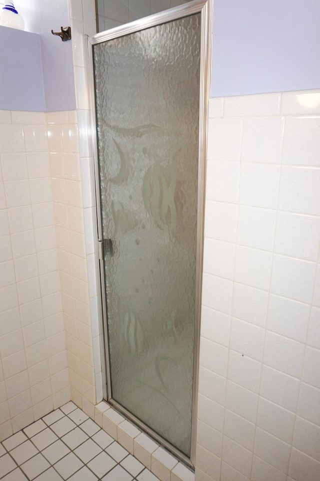 7632 W Norridge St, Harwood Heights, IL 60706 - bathroom with a stall shower, tile walls, and tile patterned flooring