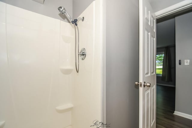 7000 Remington Ct Unit 102, Woodridge, IL 60517 - bathroom with a shower and wood finished floors