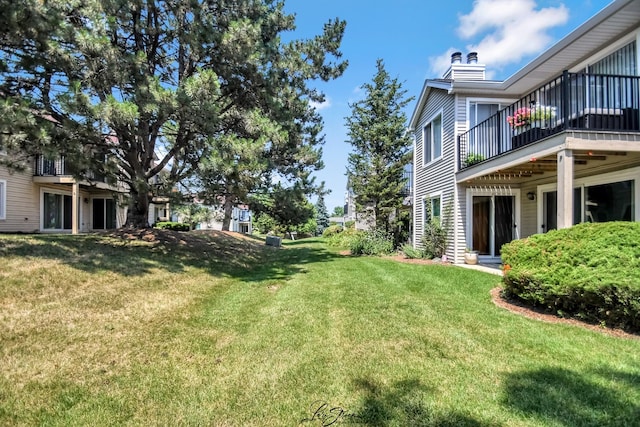 7000 Remington Ct Unit 102, Woodridge, IL 60517 - view of grassy yard featuring a balcony