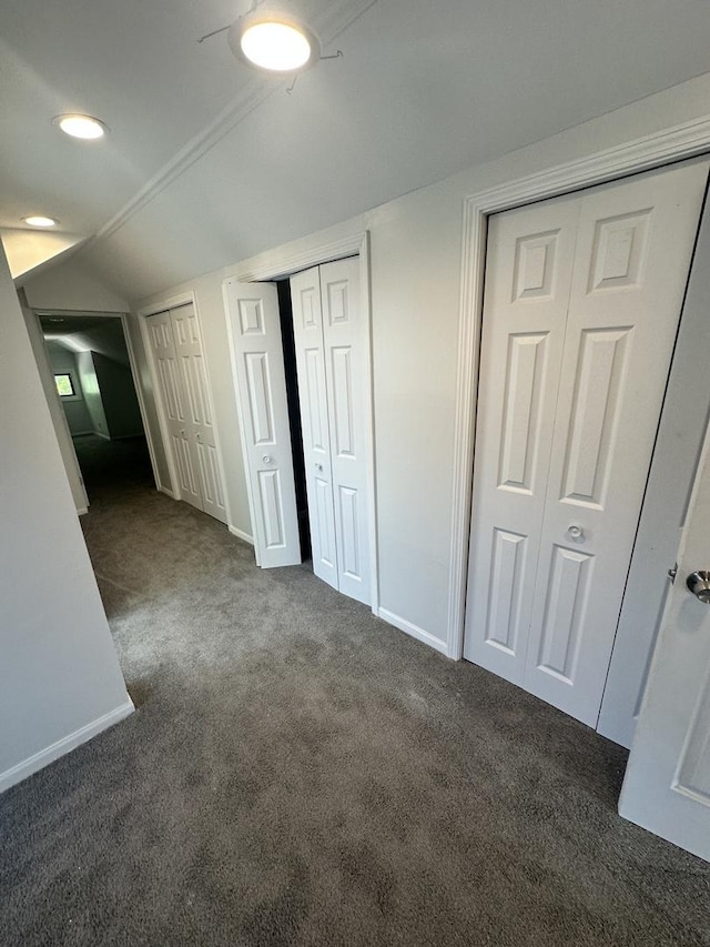 8014 S Bishop St, Chicago, IL 60620 - unfurnished bedroom featuring multiple closets, carpet floors, and vaulted ceiling