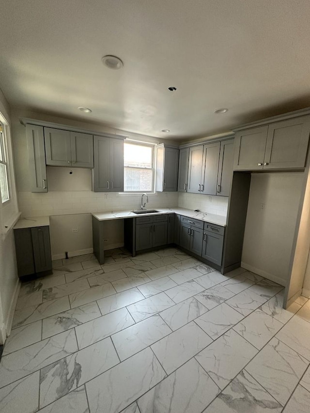 8014 S Bishop St, Chicago, IL 60620 - kitchen with gray cabinetry, light marble finish flooring, and recessed lighting