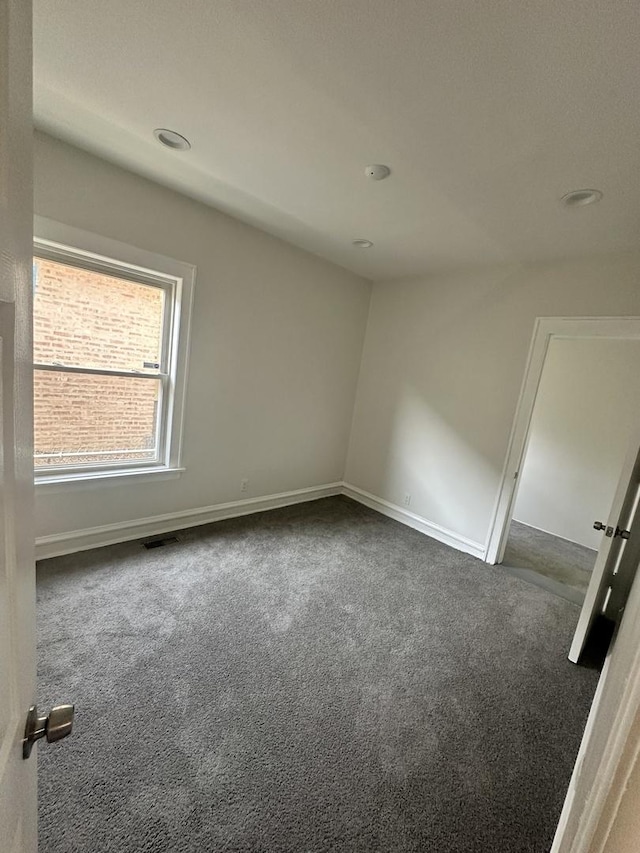 8014 S Bishop St, Chicago, IL 60620 - unfurnished room with dark colored carpet and recessed lighting