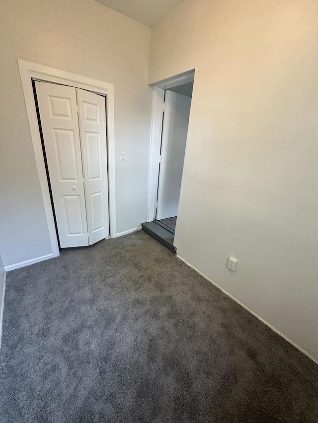 8014 S Bishop St, Chicago, IL 60620 - unfurnished bedroom with dark colored carpet and a closet
