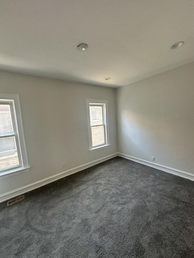 8014 S Bishop St, Chicago, IL 60620 - spare room featuring dark carpet
