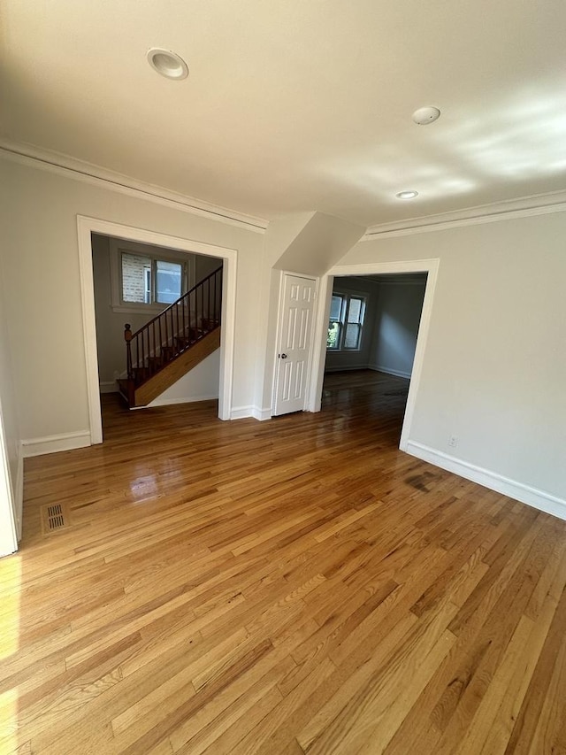 8014 S Bishop St, Chicago, IL 60620 - unfurnished room with ornamental molding, light wood-type flooring, stairs, and recessed lighting