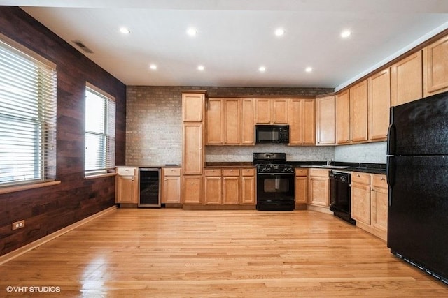 1634 W Columbia Ave Unit 2S, Chicago, IL 60626 - kitchen featuring black appliances, beverage cooler, light wood finished floors, dark countertops, and tasteful backsplash