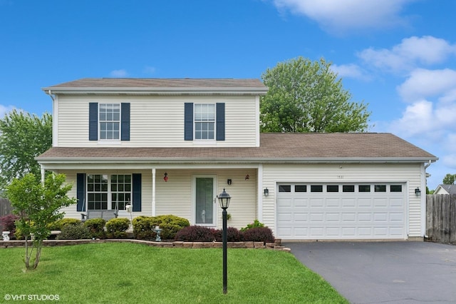 1531 Southport Ct, Zion, IL 60099 - traditional home with asphalt driveway, a garage, and covered porch