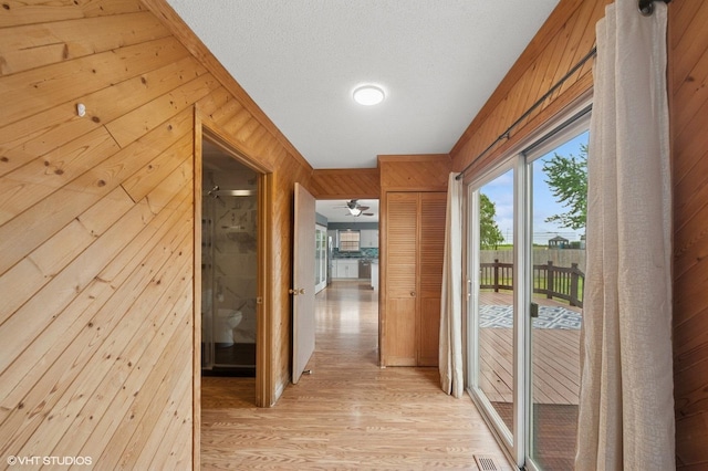 1531 Southport Ct, Zion, IL 60099 - corridor with wooden walls and light wood-style floors