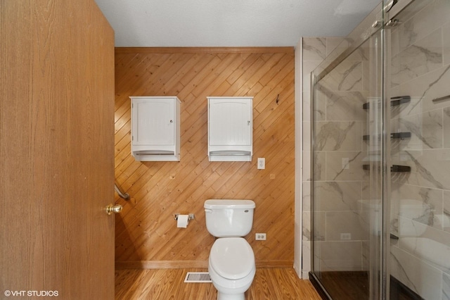 1531 Southport Ct, Zion, IL 60099 - full bath featuring a shower stall, wood finished floors, and wooden walls
