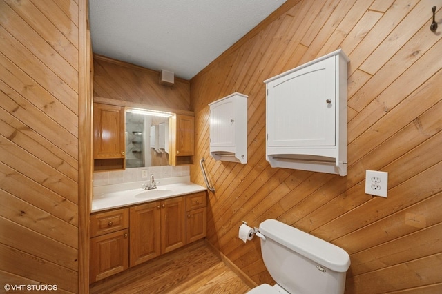 1531 Southport Ct, Zion, IL 60099 - bathroom featuring vanity, wood walls, and wood finished floors