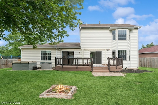 1531 Southport Ct, Zion, IL 60099 - rear view of house featuring a wooden deck and a fire pit