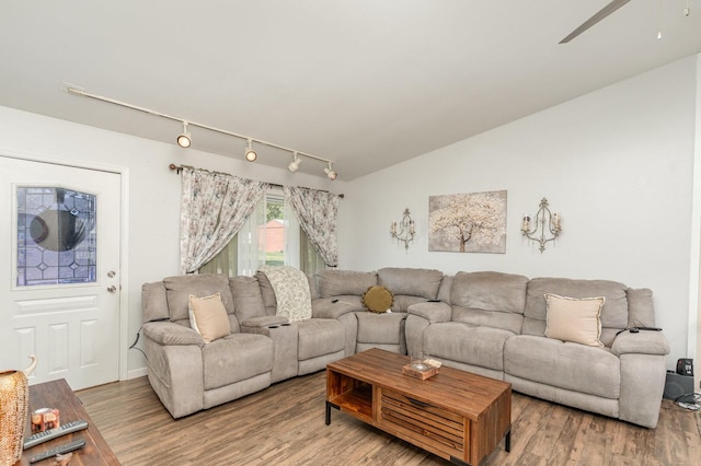 2308 Maple Ln, Rolling Meadows, IL 60008 - living room featuring rail lighting, wood finished floors, ceiling fan, and lofted ceiling