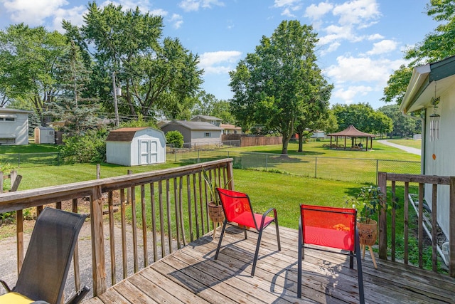 2308 Maple Ln, Rolling Meadows, IL 60008 - wooden deck featuring a gazebo, a storage unit, and a fenced backyard