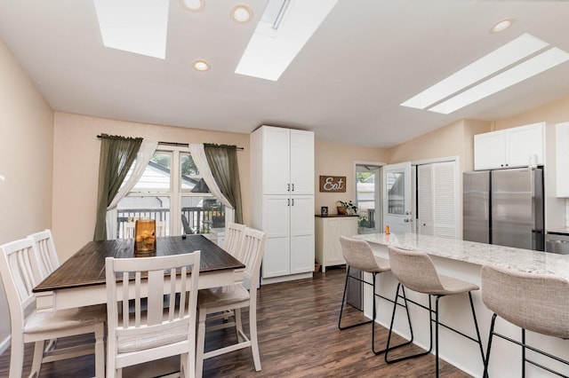 2308 Maple Ln, Rolling Meadows, IL 60008 - dining room featuring a skylight, dark wood-type flooring, vaulted ceiling, and recessed lighting