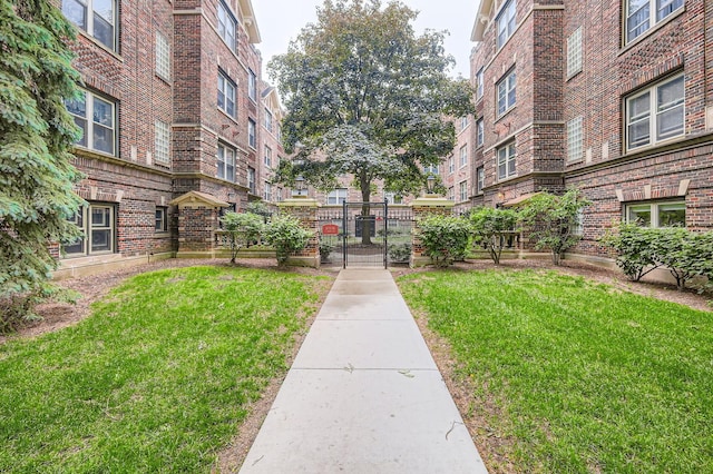 28 S 6th Ave Unit 1D, La Grange, IL 60525 - view of home's community with a gate and a lawn