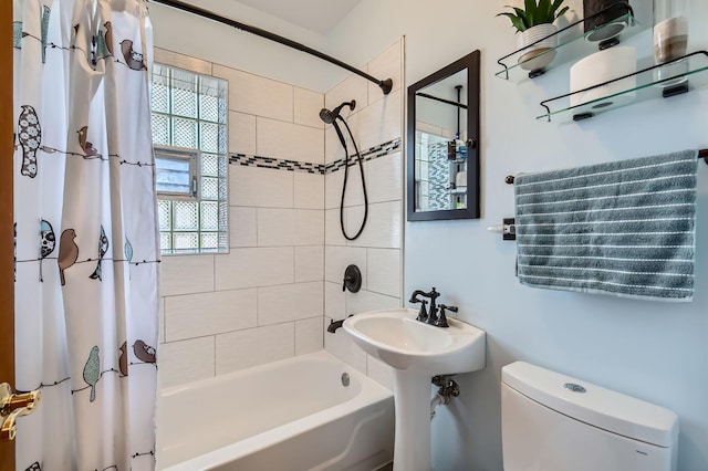28 S 6th Ave Unit 1D, La Grange, IL 60525 - bathroom featuring shower / bath combo with shower curtain and healthy amount of natural light