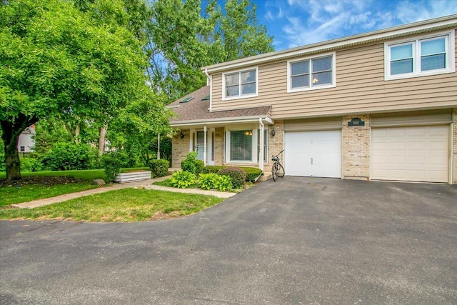 1921 Wisteria Ct Unit 3, Naperville, IL 60565 - view of front of home featuring an attached garage, driveway, and brick siding