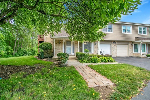 1921 Wisteria Ct Unit 3, Naperville, IL 60565 - view of front of home with brick siding, asphalt driveway, an attached garage, a front lawn, and a porch