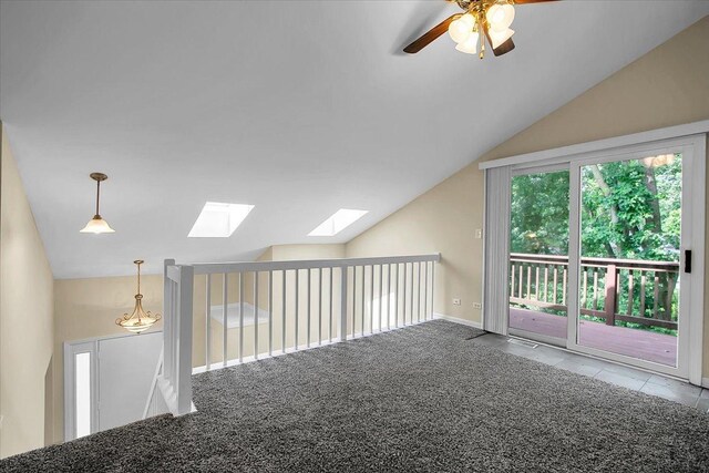 1921 Wisteria Ct Unit 3, Naperville, IL 60565 - carpeted spare room with vaulted ceiling, a skylight, and a ceiling fan