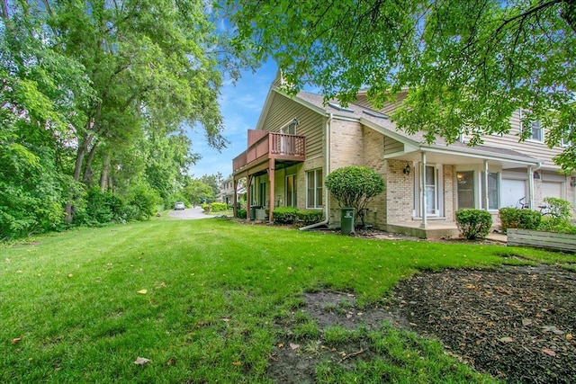 1921 Wisteria Ct Unit 3, Naperville, IL 60565 - view of side of property with a lawn, brick siding, and a balcony