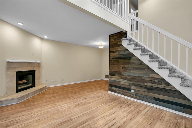 1921 Wisteria Ct Unit 3, Naperville, IL 60565 - unfurnished living room featuring wood finished floors, stairway, a fireplace, and recessed lighting