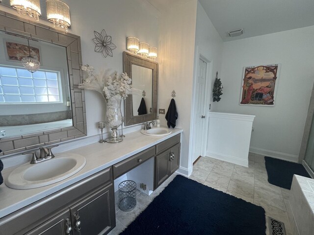 12534 Lily Ln, Plainfield, IL 60585 - bathroom featuring double vanity and a chandelier