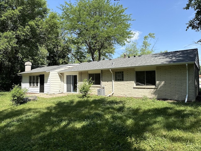 505 Barbara Ct, University Park, IL 60484 - back of property featuring a lawn, a chimney, and a shingled roof