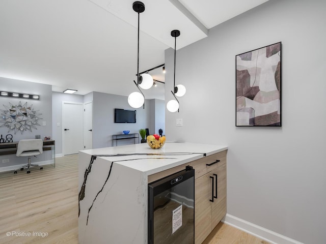 3550 N Lake Shore Dr Unit 1921, Chicago, IL 60657 - kitchen featuring beverage cooler, light wood finished floors, light countertops, modern cabinets, and hanging light fixtures