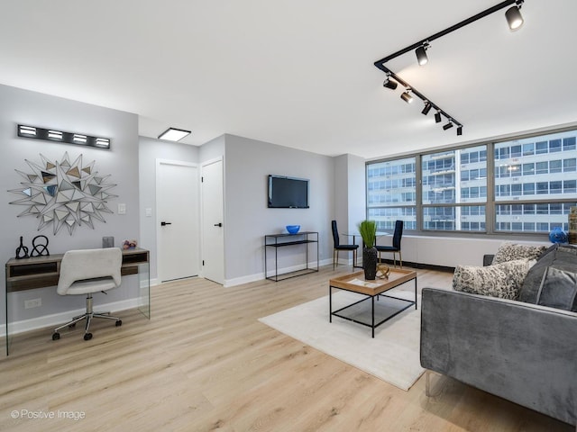3550 N Lake Shore Dr Unit 1921, Chicago, IL 60657 - living area featuring wood finished floors and rail lighting