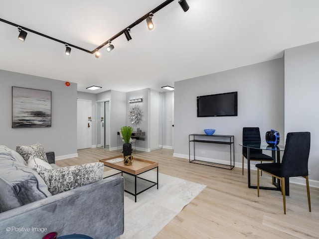 3550 N Lake Shore Dr Unit 1921, Chicago, IL 60657 - living area with track lighting and light wood-style floors