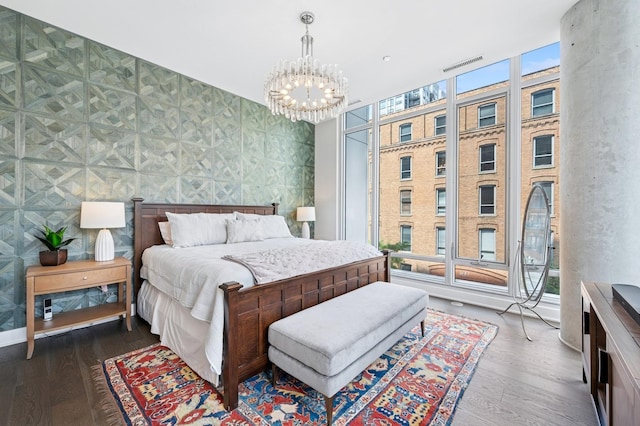 360 W Erie St Unit 3A, Chicago, IL 60654 - bedroom featuring a chandelier, multiple windows, and wood finished floors