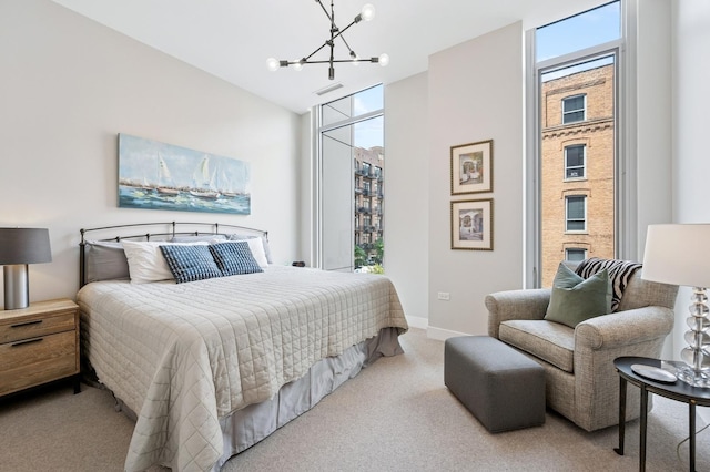 360 W Erie St Unit 3A, Chicago, IL 60654 - bedroom featuring a chandelier, carpet flooring, multiple windows, and a high ceiling