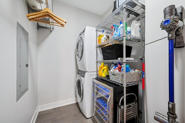 360 W Erie St Unit 3A, Chicago, IL 60654 - laundry area with stacked washer and clothes dryer, electric panel, beverage cooler, and tile patterned floors