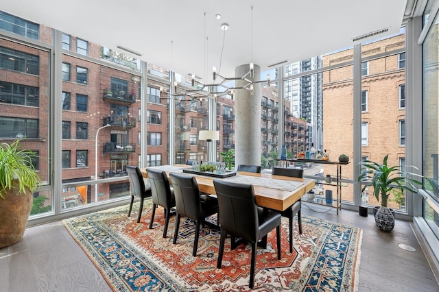 360 W Erie St Unit 3A, Chicago, IL 60654 - dining area with expansive windows and wood finished floors