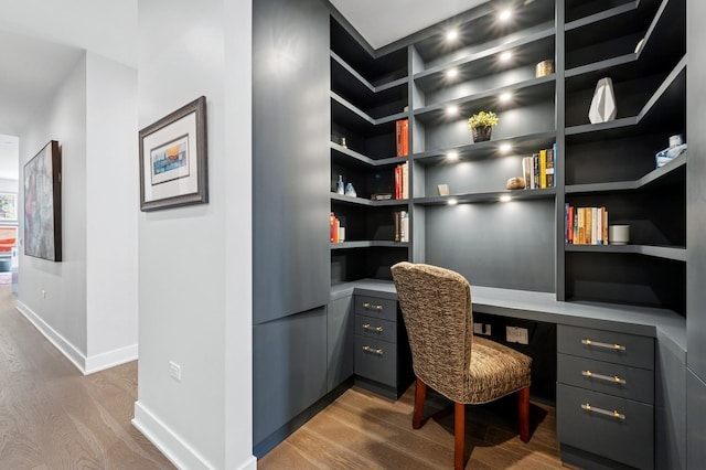 360 W Erie St Unit 3A, Chicago, IL 60654 - office area with built in study area, wood finished floors, and built in shelves