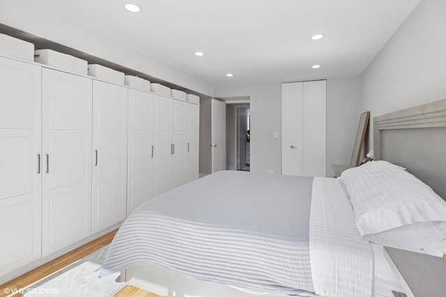 7200 N Ridge Blvd Unit 2C, Chicago, IL 60645 - bedroom with recessed lighting, two closets, and light wood-type flooring