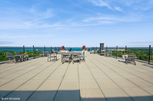 4960 N Marine Dr Unit 519, Chicago, IL 60640 - view of patio featuring a water view and outdoor dining space