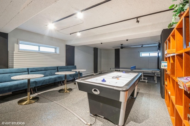 4960 N Marine Dr Unit 519, Chicago, IL 60640 - rec room featuring track lighting, speckled floor, and a textured ceiling
